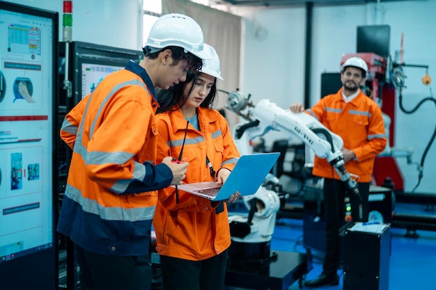 A group of Robotics engineers working with Programming and Manipulating Robot Hand