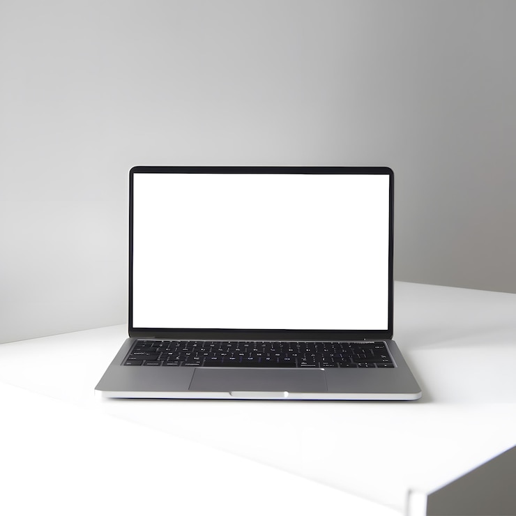 Photo a laptop with a blank screen is sitting on a white table
