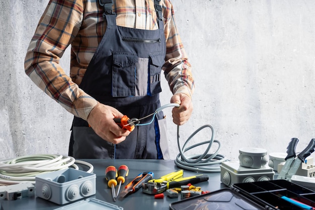A professional electrician connecting wires on site