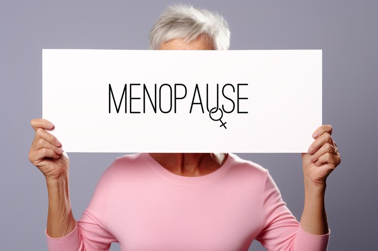 A woman holding up a pink sign with word Menopause Generative AI image