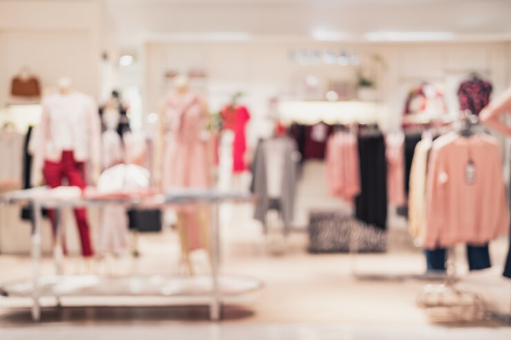 Abstract sfondo sfocato di interni negozio di abbigliamento al centro commerciale