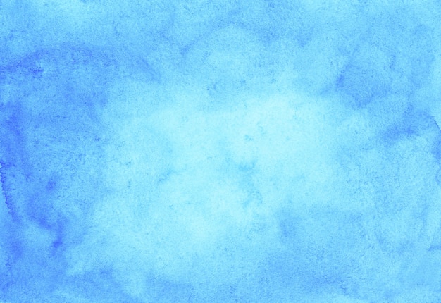 Acquerello sfondo azzurro trama dipinta a mano. Macchie blu cielo dell'acquerello su carta.