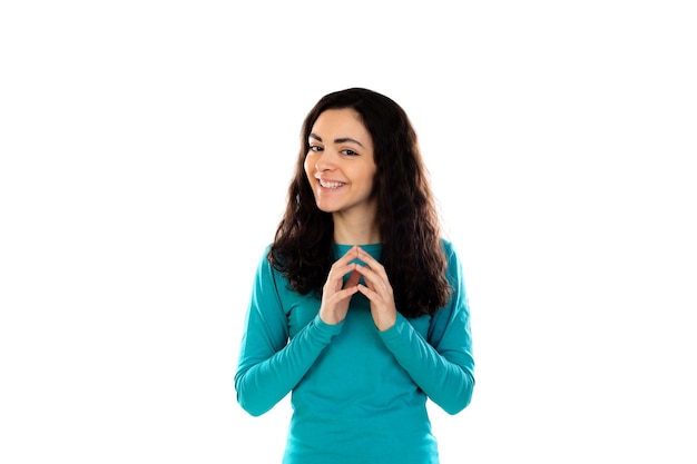 Adorabile ragazza adolescente con maglione blu isolato su un muro bianco