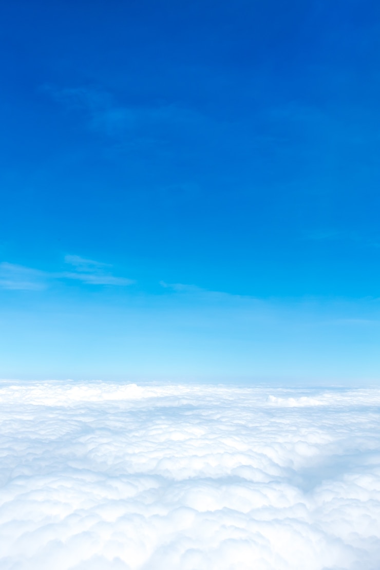 Photo aerial view of blue sky and cloud top view from airplane window