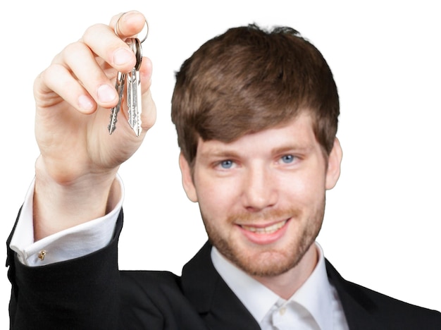Agente immobiliare che mostra la chiave della nuova casa