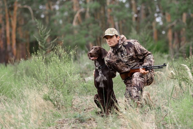 Alert Hunter and Dog in Forest Animal Chasing.