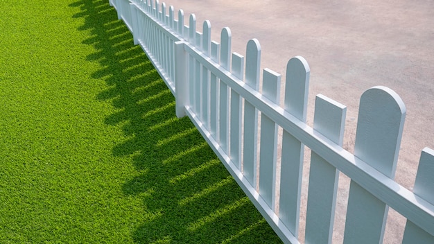 Ampio angolo e vista diagonale del picchetto di legno bianco con erba artificiale verde nell'area del cortile anteriore