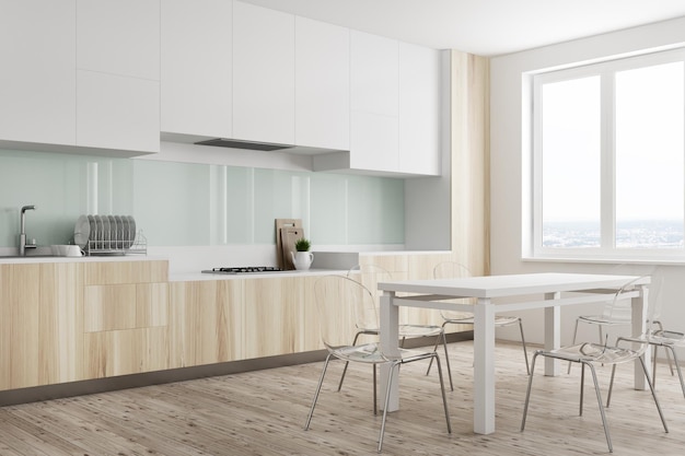 Angolo cucina in legno con pareti bianche e verdi, una grande finestra, controsoffitti in legno e un tavolo bianco. Rendering 3d mock up