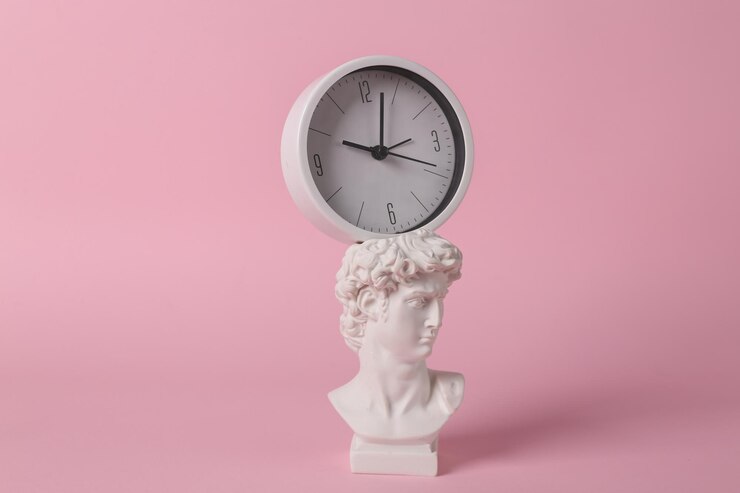 Antique David bust with clock on pink background Conceptual pop Minimal still life Creative idea