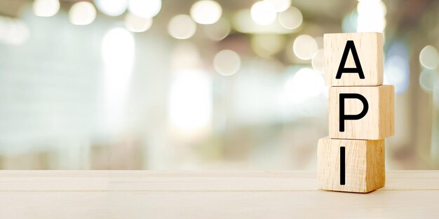 application programming interface api word on wooden blocks over blur background