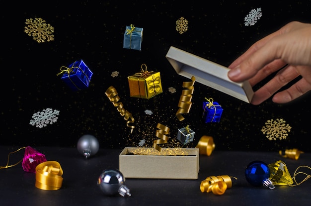 Apri Magic Christmas Gift Box decorazioni, polvere d'oro, nastro