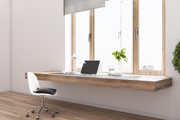 Area di lavoro elegante con tavolo in legno e parete luminosa da pavimento con vista sulla città soleggiata, sedia bianca e laptop