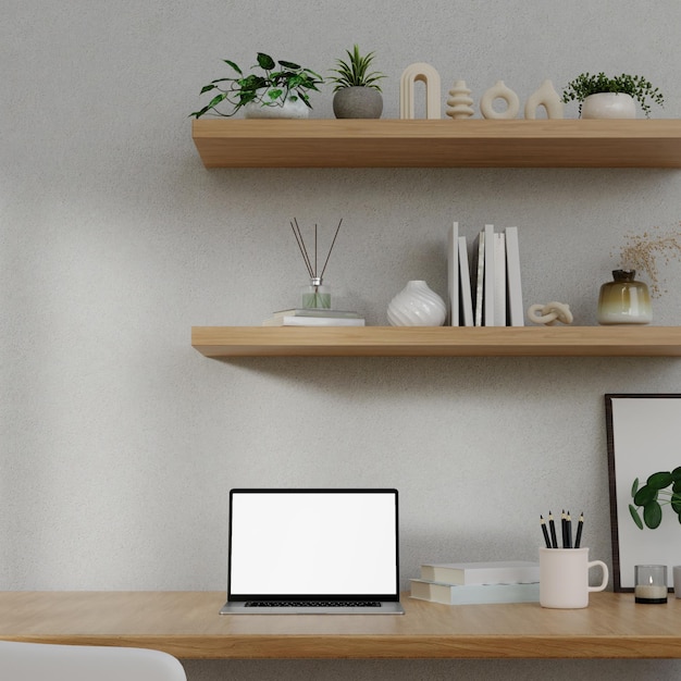 Area di lavoro minimalista con un mockup di laptop su un tavolo in un'illustrazione di rendering 3d minima dell'ufficio