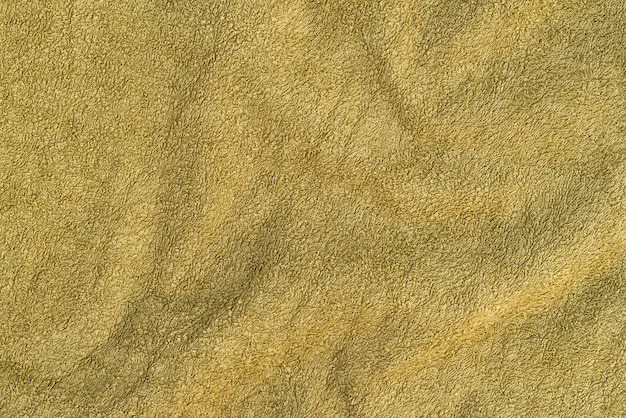 Asciugamano in spugna di texture con pieghe. Colore oliva