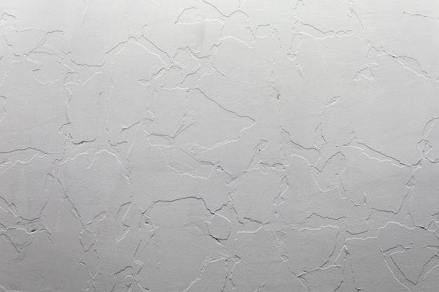 Astratto sfondo bianco non ostentato e texture Un muro di gesso con il vecchio strato incrinato sotto uno nuovo