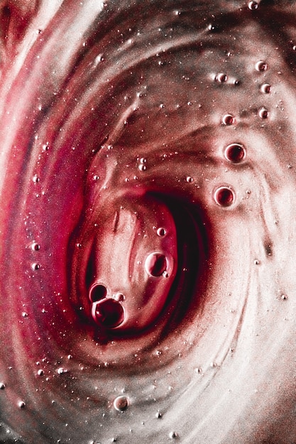 Astratto sfondo liquido vernice splash swirl pattern e gocce d'acqua gel di bellezza e texture cosmetica...