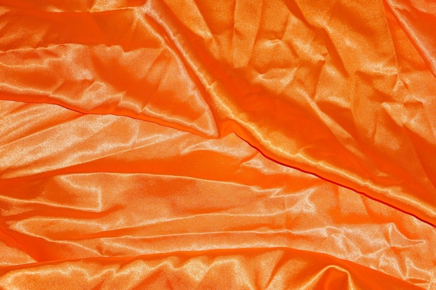 Astratto sfondo panno arancione con onde morbide