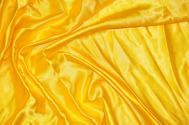 Astratto sfondo panno giallo con onde morbide