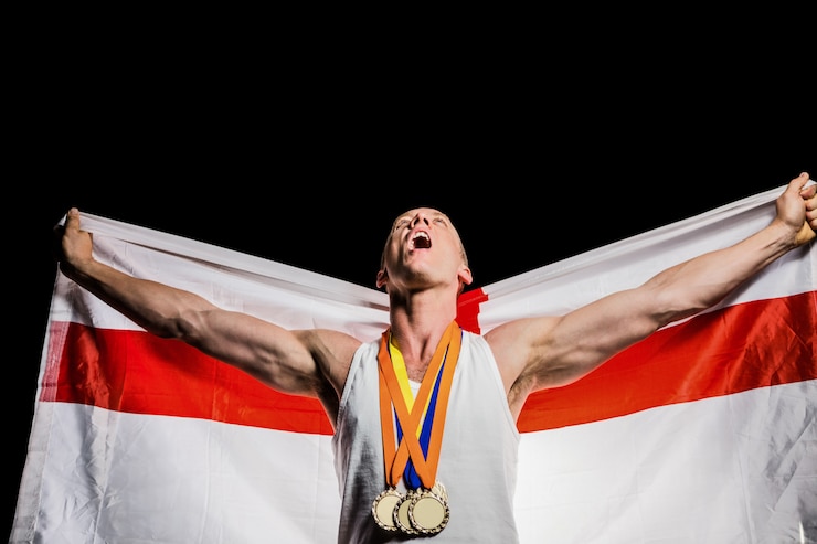 Foto atleta in posa con medaglie d'oro dopo la vittoria