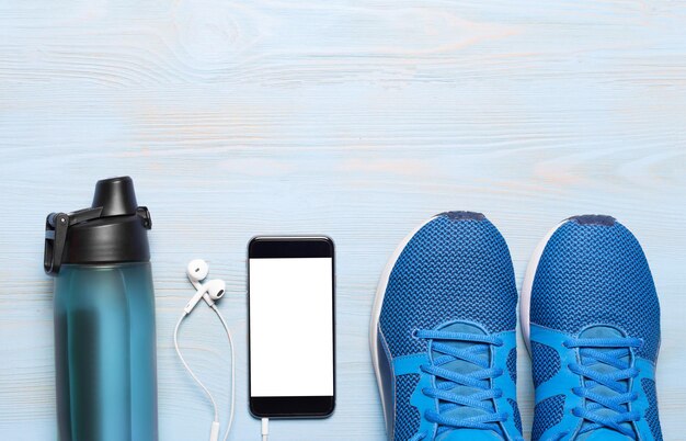 Attrezzature sportive scarpe da ginnastica per saltare la corda manubri smartphone e cuffie