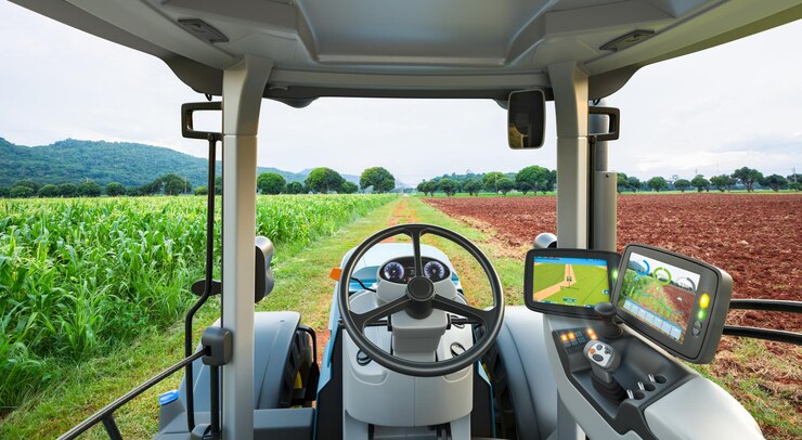 Autonomous tractor working in corn field Future technology with smart agriculture farming concept