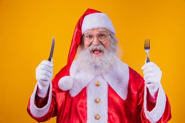 Babbo Natale con coltello e forchetta