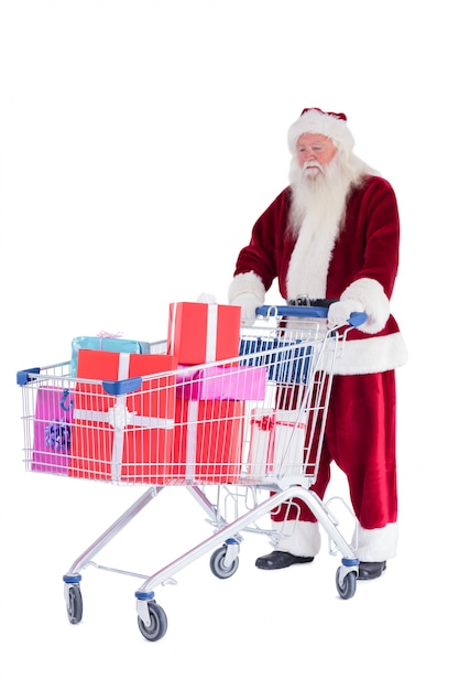 Babbo Natale spinge un carrello della spesa con regali