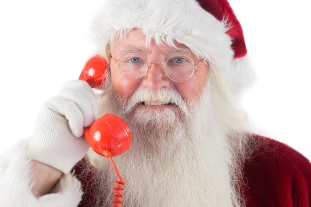 Babbo Natale sul suo telefono rosso