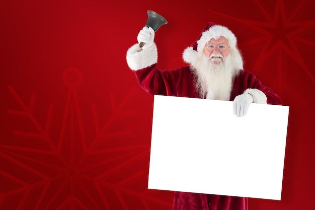 Babbo Natale tiene un cartello e suona il campanello su sfondo rosso