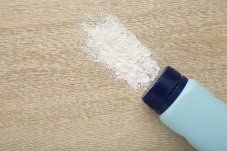 Baby powder on light background Baby cosmetics