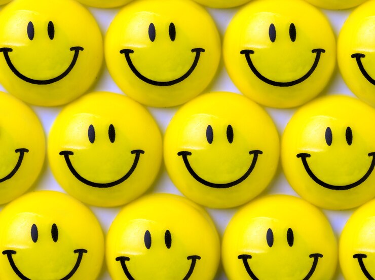 Photo background of many yellow smileys