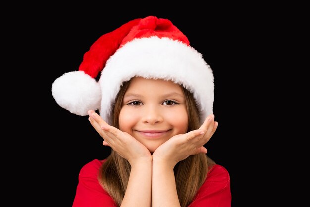 Bambina in un cappello di Natale