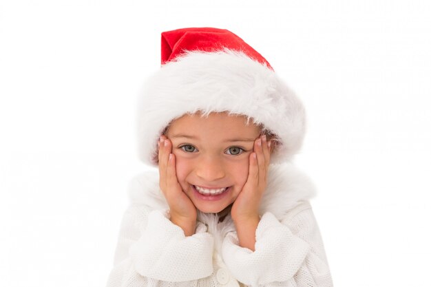 Bambina sveglia che porta il cappello della Santa