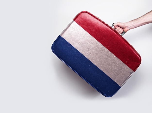 Bandiera dei Paesi Bassi su una valigia in pelle vintage