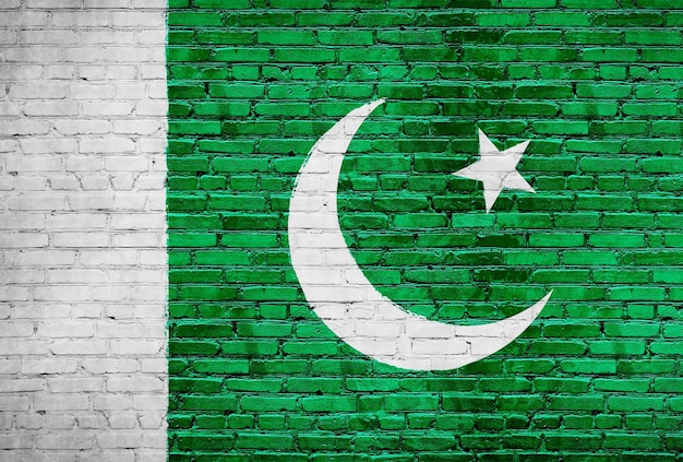 Bandiera del Pakistan dipinta su un muro di mattoni Foto di sfondo della bandiera nazionale del paese