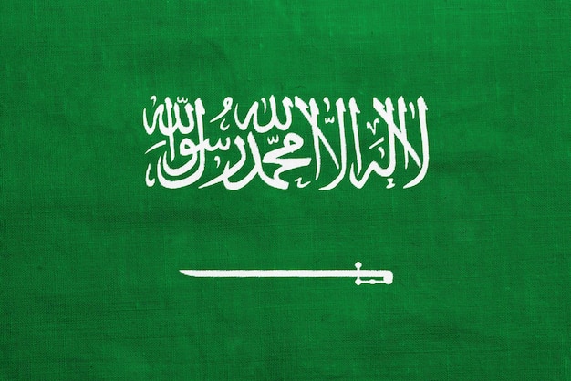 Bandiera del Regno dell'Arabia Saudita su uno sfondo testurato Collage concettuale