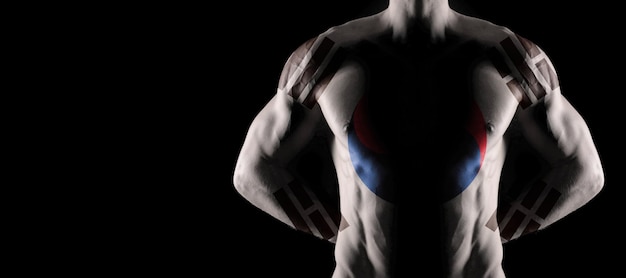 Bandiera della Corea del Sud sul torso maschile muscoloso con addominali, sfondo nero