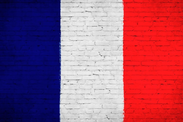 Bandiera della Francia dipinta su un muro di mattoni Foto di sfondo della bandiera nazionale del paese