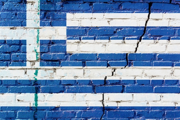 Bandiera della Grecia dipinta su un vecchio muro di mattoni