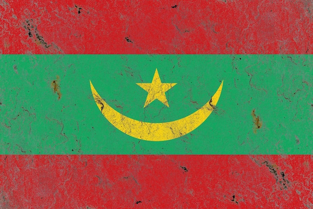 Bandiera della Mauritania dipinta su un vecchio muro di cemento rustico danneggiato