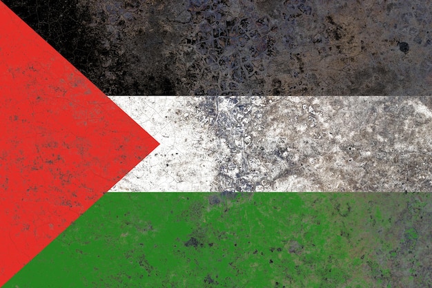 Bandiera della Palestina su una vecchia superficie danneggiata del muro di cemento