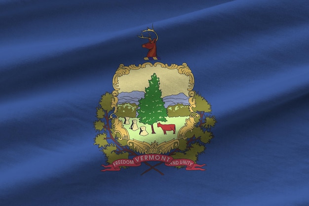 Bandiera dello stato degli Stati Uniti del Vermont con grandi pieghe che ondeggiano da vicino sotto la luce dello studio all'interno I simboli e i colori ufficiali nel banner