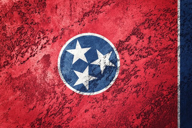 Bandiera dello stato del Tennessee di lerciume. Struttura del grunge del fondo della bandiera del Tennessee.