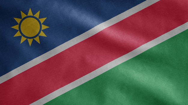 Bandiera namibiana che fluttua nel vento. Bandiera della Namibia che soffia, seta morbida e liscia.