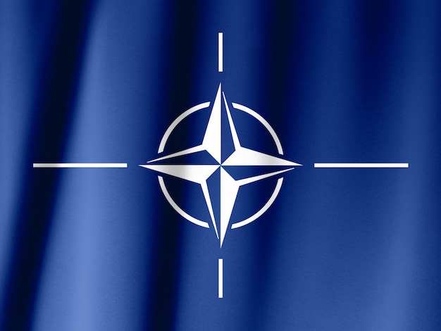 Bandiera NATO - Foto ravvicinata di sventolare bandiera NATO originale e semplice.