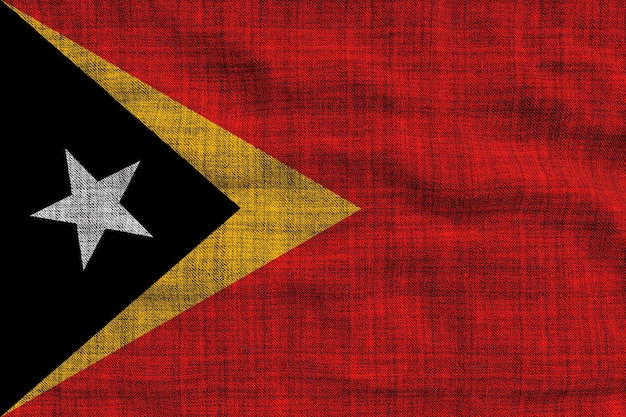 Bandiera nazionale di Timor orientale Sfondo con la bandiera o di Timor orientale
