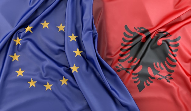 Bandiere arruffate dell'Unione europea e del rendering 3D dell'Albania