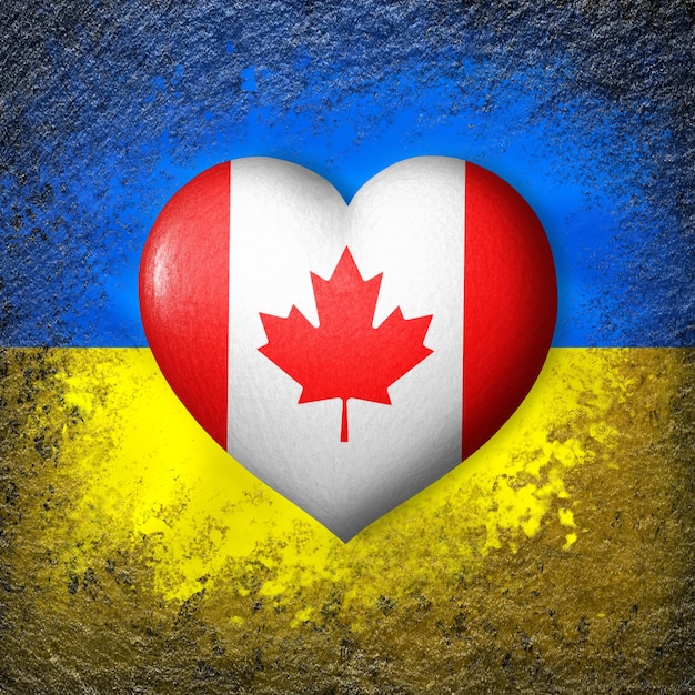 Bandiere di Ucraina e Canada Bandiera cuore sullo sfondo della bandiera ucraina