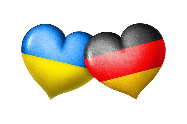 Bandiere di Ucraina e Germania Due cuori nei colori delle bandiere isolate su un bianco
