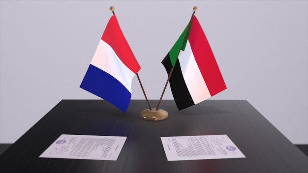 Bandiere nazionali del Sudan e della Francia sul tavolo nella sala conferenze diplomatica Accordo di accordo politico